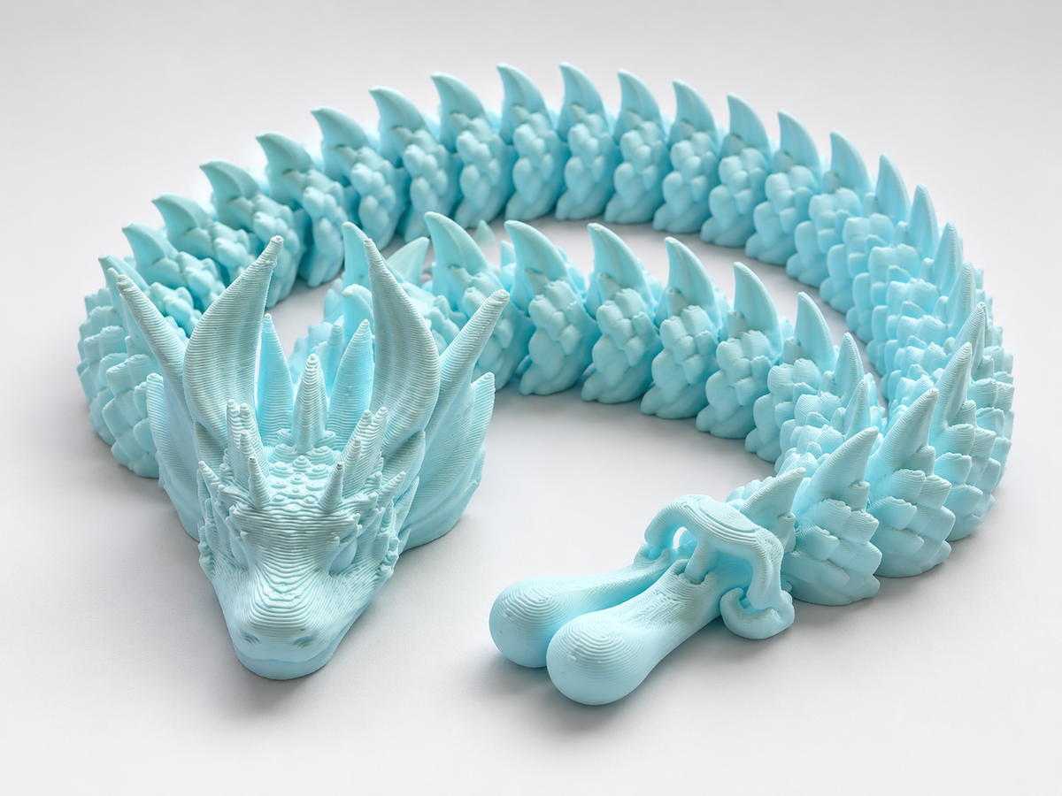 Giant Articulated Dragon in a coiled pose on a plain background